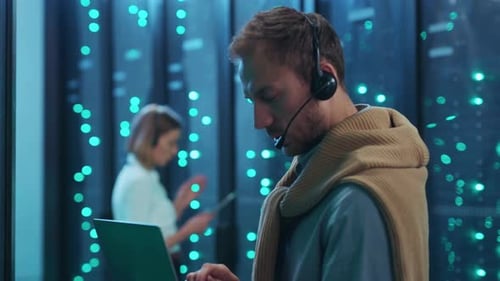 Skilled Professional in a Modern Technology Environment Equipped with a Headset for Efficiency