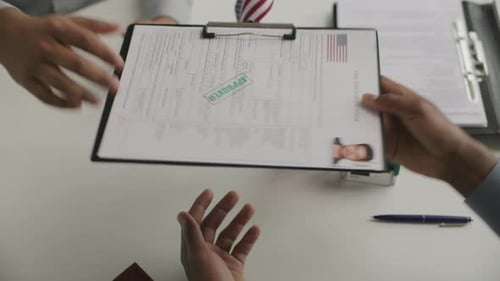 Visa Application Approved with Handshake in Office