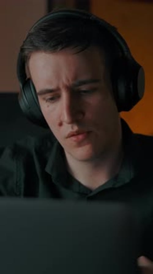 Young Adult Sits, Chats, and Swivels to Keyboard