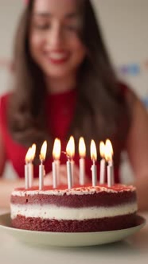 Smiling Woman with Birthday Cake and Candles