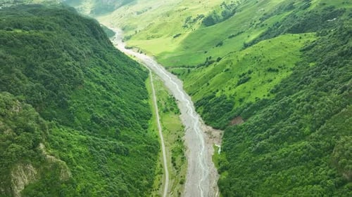 Aerial Drone View of Lush Green Mountain Valley and River
