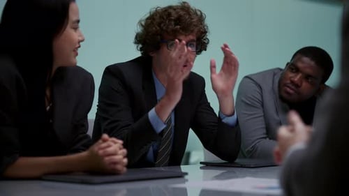 Business People Meeting and Shaking Hands at Table