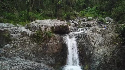 Slow Motion Aerial View of Las Garzas Waterfall, Charco El Ataud, Puerto Rico. Fresh Mountain Creek