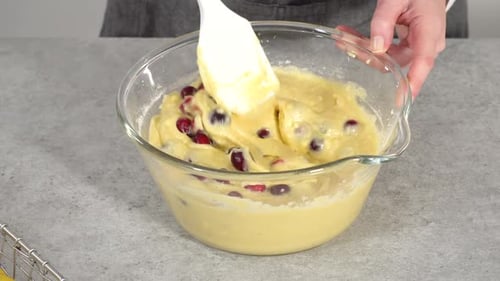 Step By Step Mixing Ingredients in a Glass Mixing Bowl to Prepare Lemon Cranberry Bundt Cake