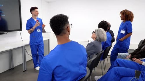 Medical Presentation with Students in Scrubs in Classroom