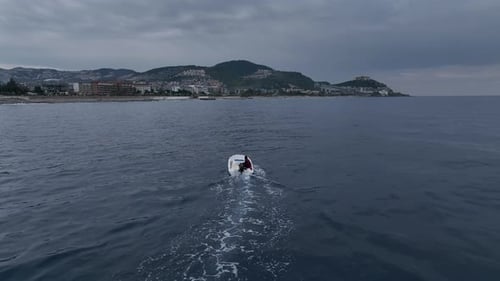 Old Fisherman Spreads His Fishing Nets in the Sea Near the Shore Aerial View Background