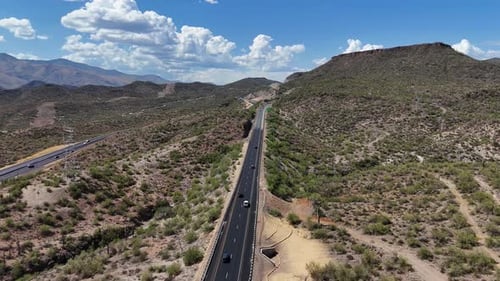 Drone Flying over Interstate 17 North of Black Canyon City in Arizona. Few cars driving on highway.