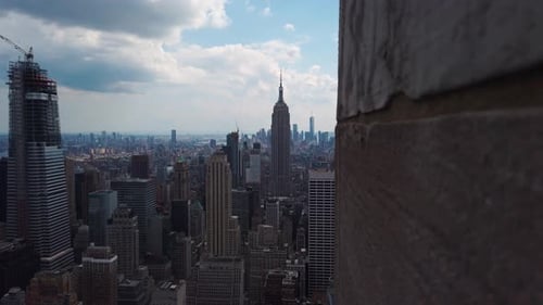 New York cityscape from above the Empire State Building, looking down at the city, cloud day