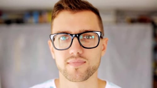 Smiling Man Wearing Glasses Close Up View