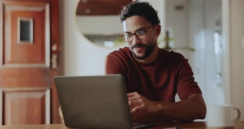 Creative, glasses and man with laptop, home or research for article, remote work