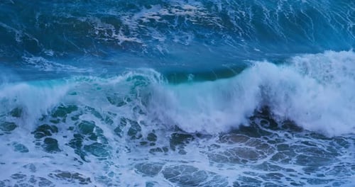 Majestic Ocean Wave Breaking with Turquoise Blue Water and White Foam