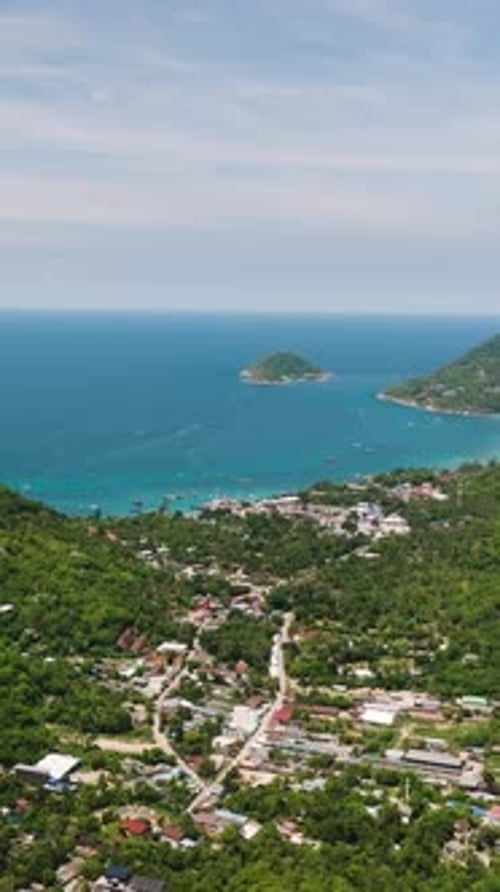 Tropical Coastline with Lush Greenery and Clear Blue Waters Koh Tao Thailand