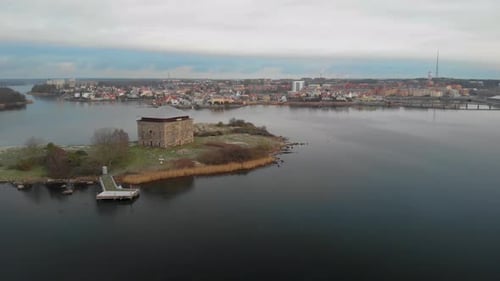 Aerial footage of Kruthuset a historical old building located in the ocean at Karlskrona, Sweden. I