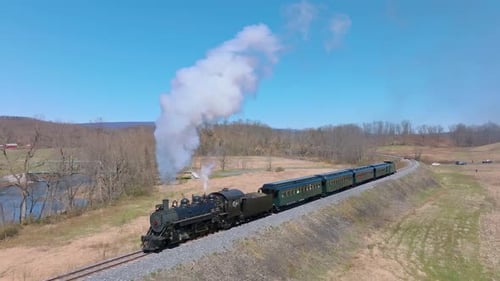 Scenic Steam Locomotive Journey Through Rural Landscapes