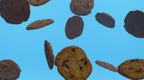 Animated Chocolate Chip Cookies Falling on Blue Background