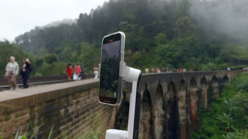 Shooting on tripod phone while traveling. Action. Shooting video on phone with stabilizer