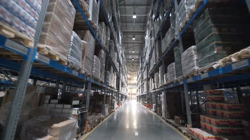 Warehouse interior ascending view of cardboard boxes on shelves