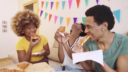 Friends Eating Pizza and Talking at Home
