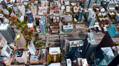 Daytime view of the modern Seattle, Washington, US. Drone footage along the busy wide-lane highway.