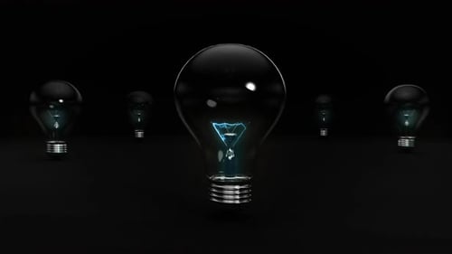 Energetic Exploding Blue Light Bulb On Black Background