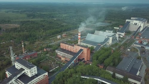 Industrial Plant Emitting Smoke in Rural Landscape