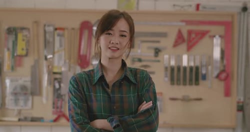 Worker young asian woman carpenter crossed arm smiling building design wooden