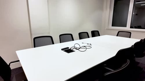 Bright Empty Meeting Room With White Table And Black Chairs For Corporate Presentations And