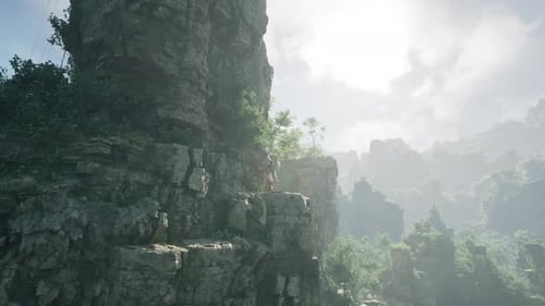 A Stunning Rocky Cliff with Lush Vegetation Overlooking the Landscape