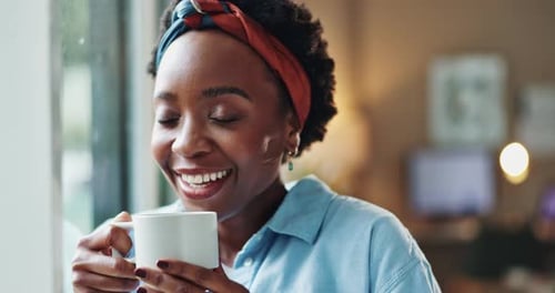 Woman Smiling and Holding a Mug Close Up