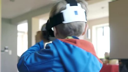 Child uses VR headset at home