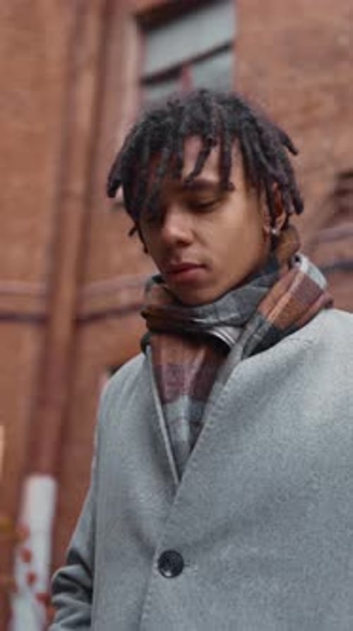 Vertical Portrait of Handsome Young African American Male Person in Fall Season in City Lane Autumn