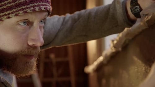 Focused Artist Sculpting Clay with Hands