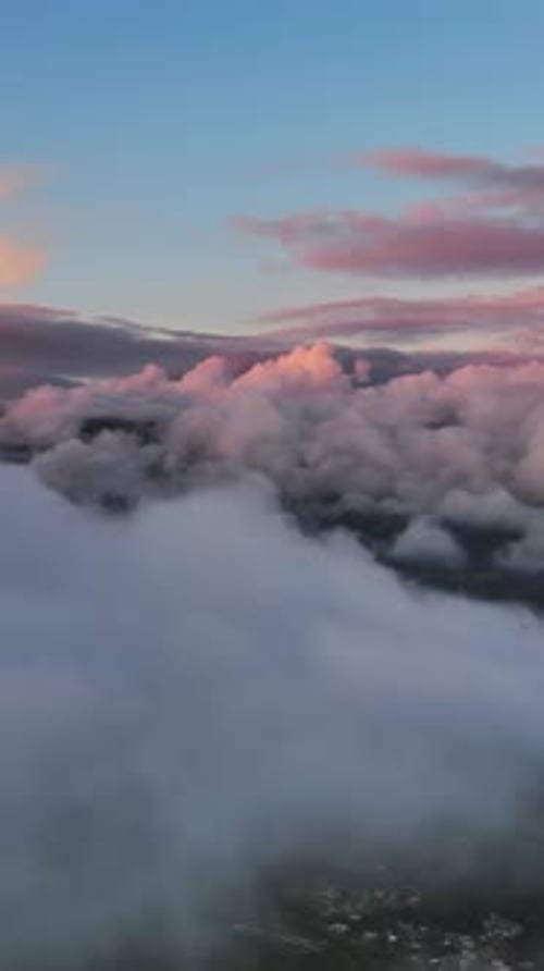 Aerial View of Fluffy Clouds at Sunset