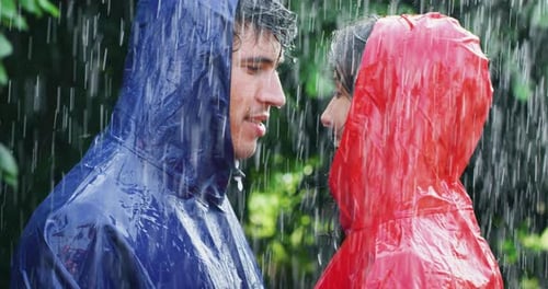 Couple Embracing in the Heavy Rain Together