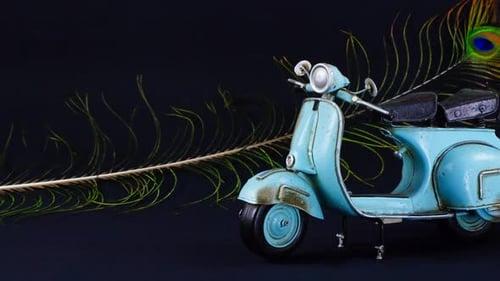 Vintage Blue Scooter with a Peacock Feather