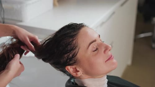 Woman Getting her Hair Washed at Hair Salon