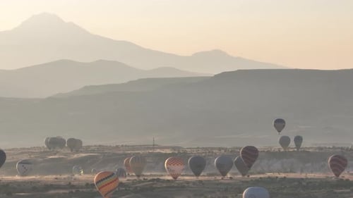 Aerial View of Natural Rock Formations in the Sunset Valley with Cave Houses in Cappadocia Turkey