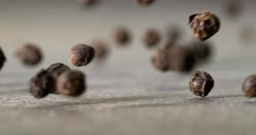 Peppercorns or black pepper spice. Super Macro Close Up. Shot on super slow motion camera 1000 fps.