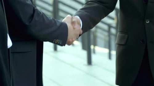 Close Up of Businessmen Shaking Hands
