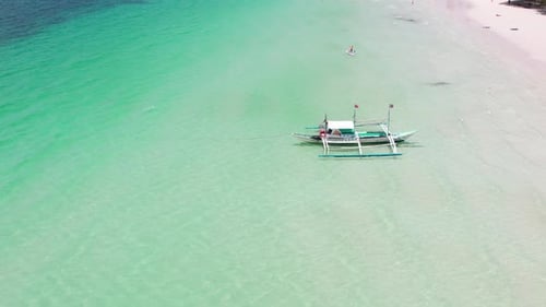 Aerial Shot Over Azure Waters Capturing an Amazing View of a Boat on the Blue Surface of the Ocean