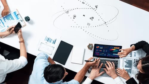 Creative Team Collaborating on Business Strategy with Analytical Charts, Diagrams, and Visual Data R