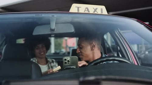 Taxi Driver Shows Off Money to Smiling Passenger