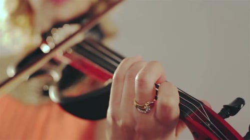 Young Girl Practicing the Violin