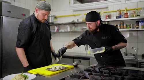 Professional Chefs Preparing Gourmet Dishes in Kitchen
