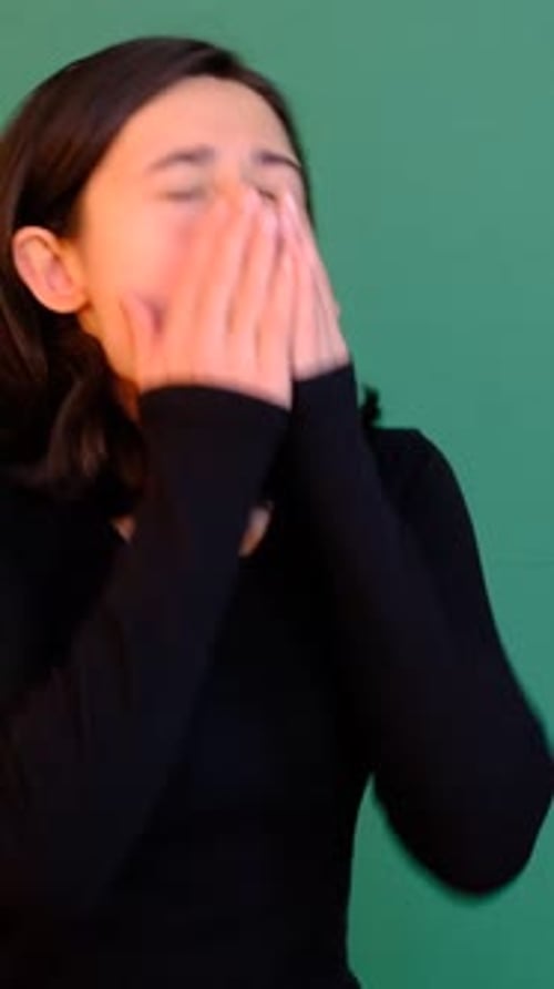 Woman Sneezing Green Background