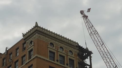 A close-up view of the historic facade of a high-rise building in Youngstown, Ohio, being demolished