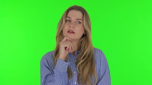 Pensive Young Woman Thinking an Idea on Green Background