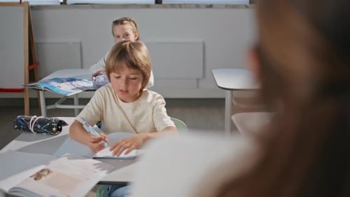 Children Studying in a Classroom Setting