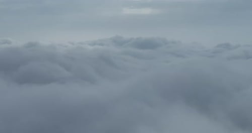 White Fluffy Clouds in Aerial View Under Gray Sky