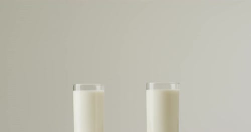 Video of biscuits with chocolate and milk on white background